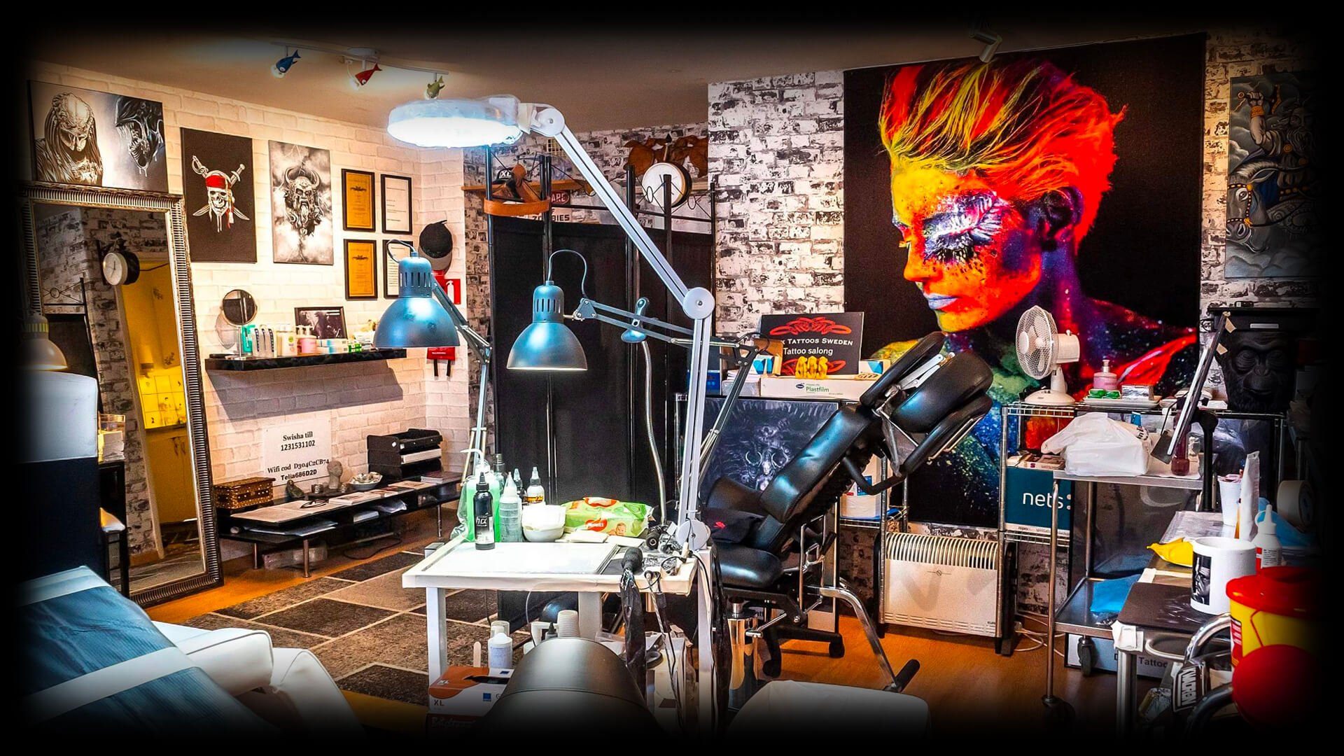 Professional tattoo artist making a tattoo on a man skin while working in a dark  tattoo studio. Tattooing. Concept of art and design. photo – Black men  Image on Unsplash